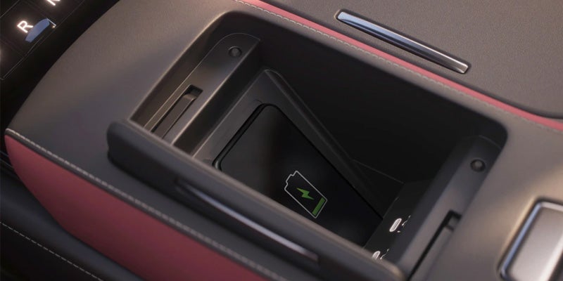 Close-up of a car's center console storage compartment.