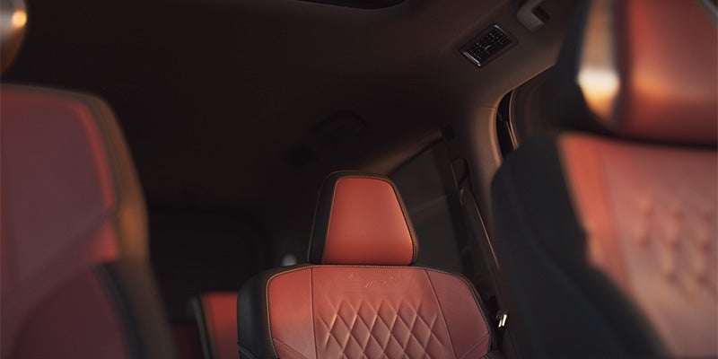 Interior of a car with brown leather seats.