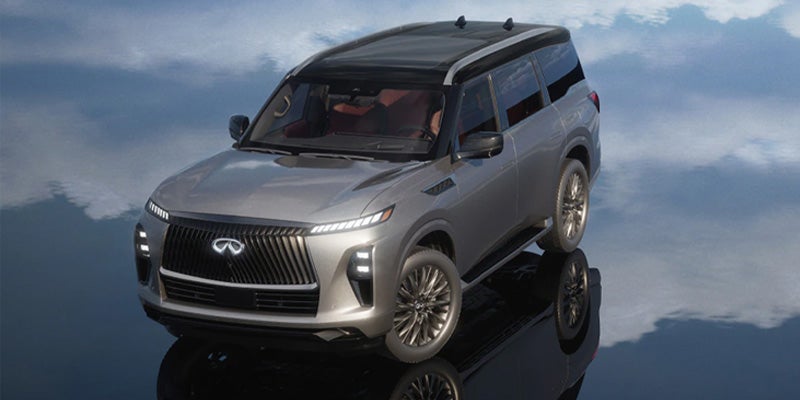 Silver INFINITI QX80 parked on a reflective surface.